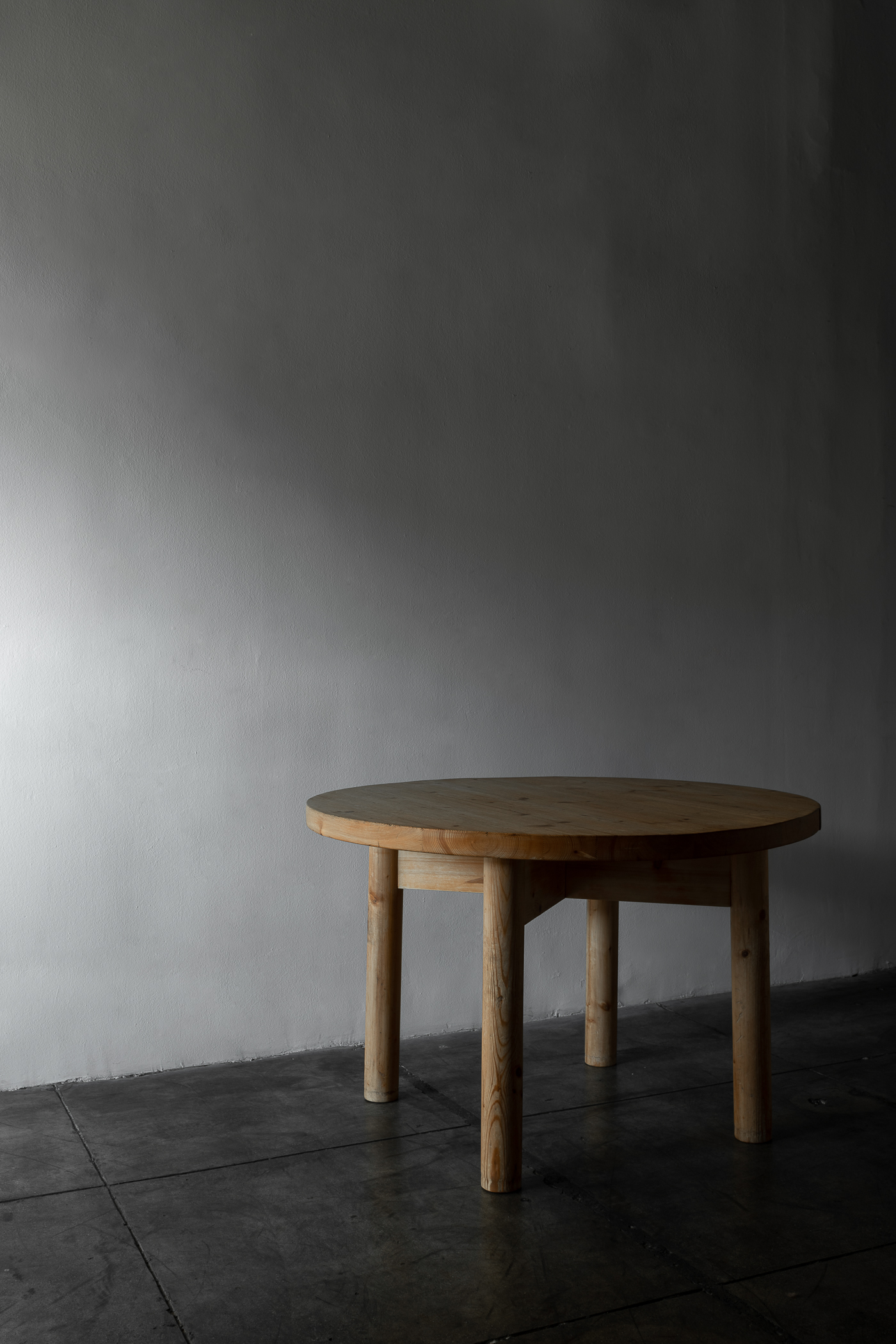 Round pine table by Charlotte Perriand.